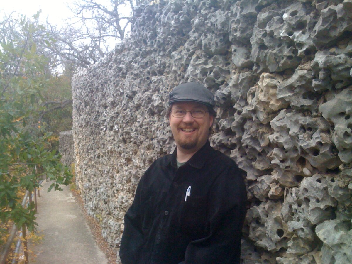 Park in front of a stone wall